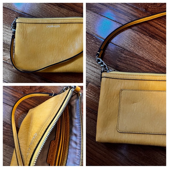 Calvin Klein Handbags - Calvin Klein leather mustard colored clutch -HOC Autumn